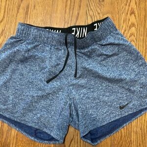 Ladies Nike Dri-Fit Blue Size  Small Shorts with elastic drawstring waistband.